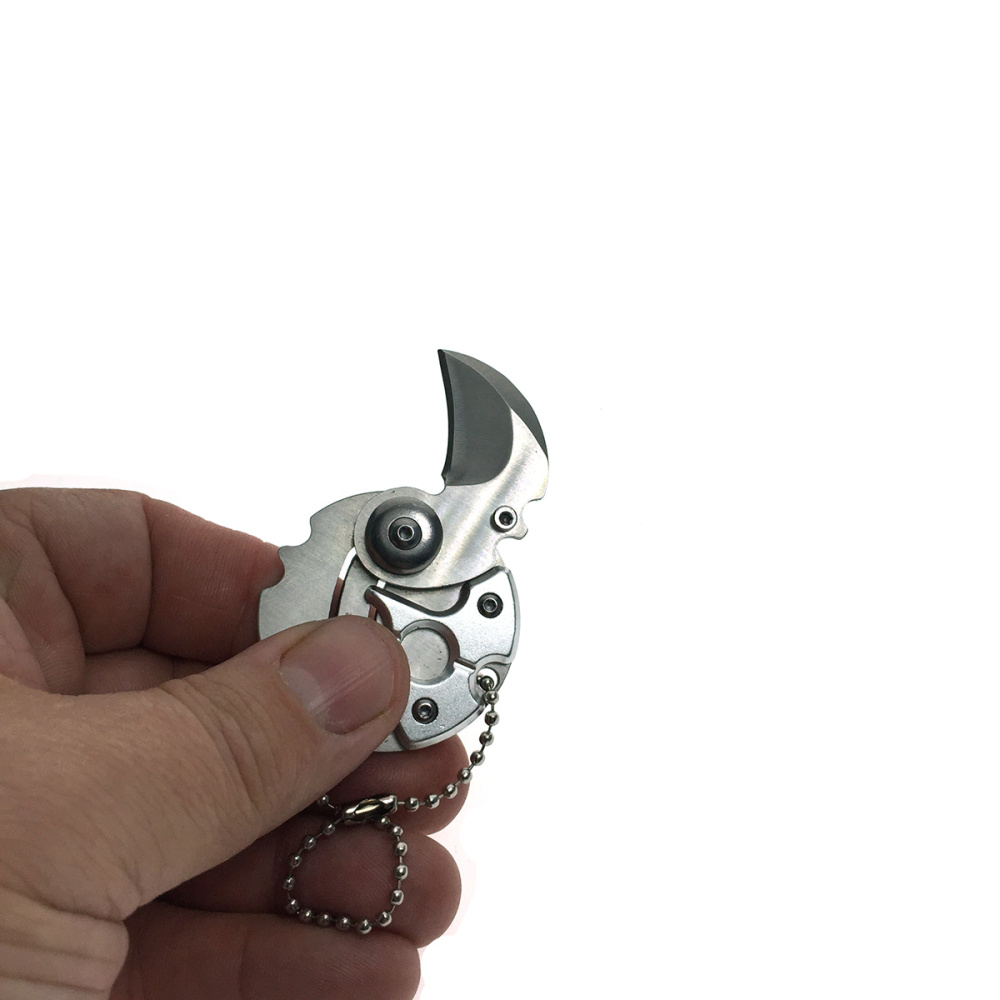 картинка Брелок мини - нож Коготь складывающийся круглый, цвет серебро 